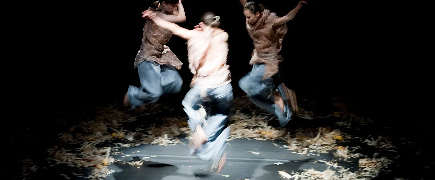 Prosxima Dance Company choreographic work mneme shows three women jumoing high forming a circle with their bodies