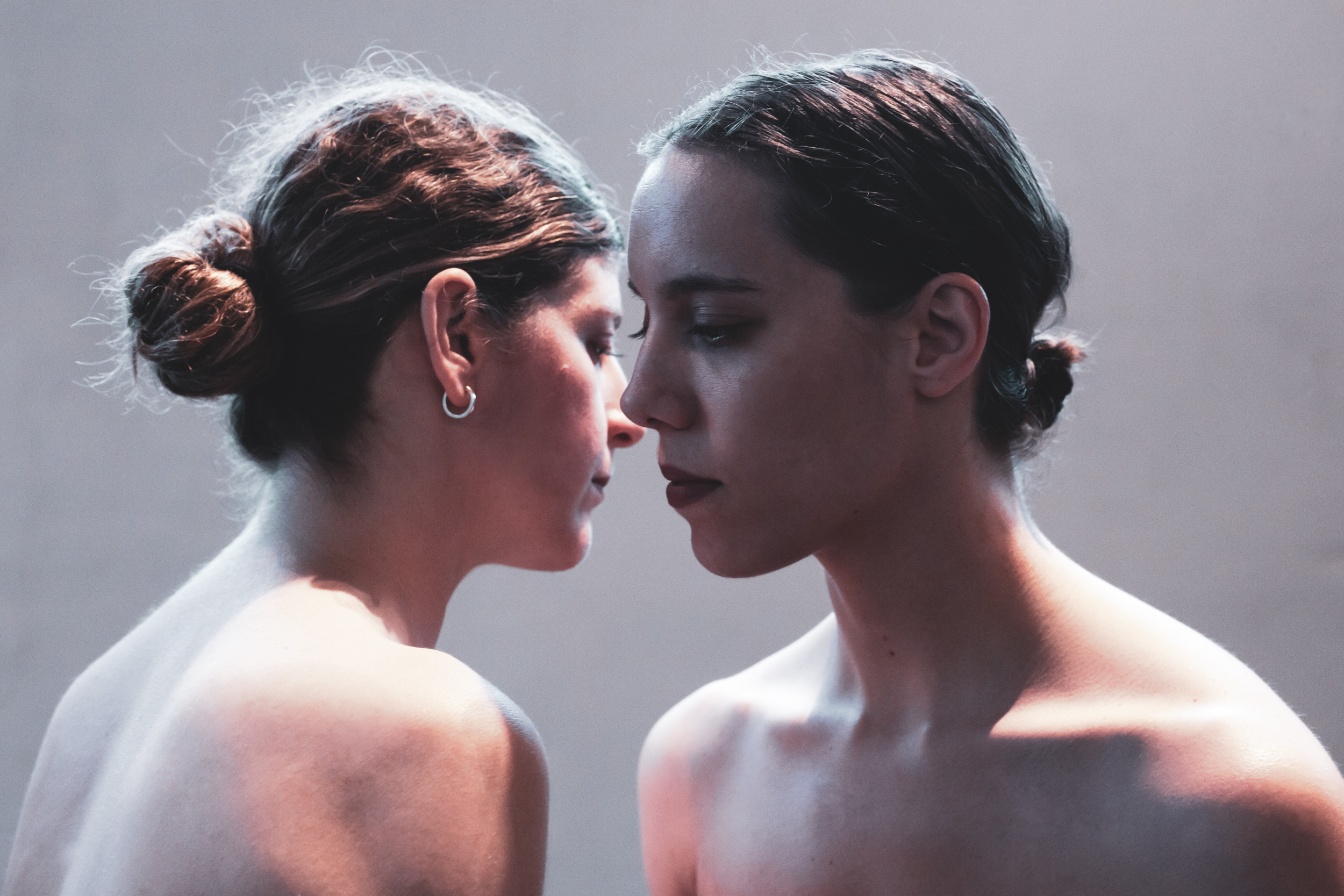 two women facing each other 