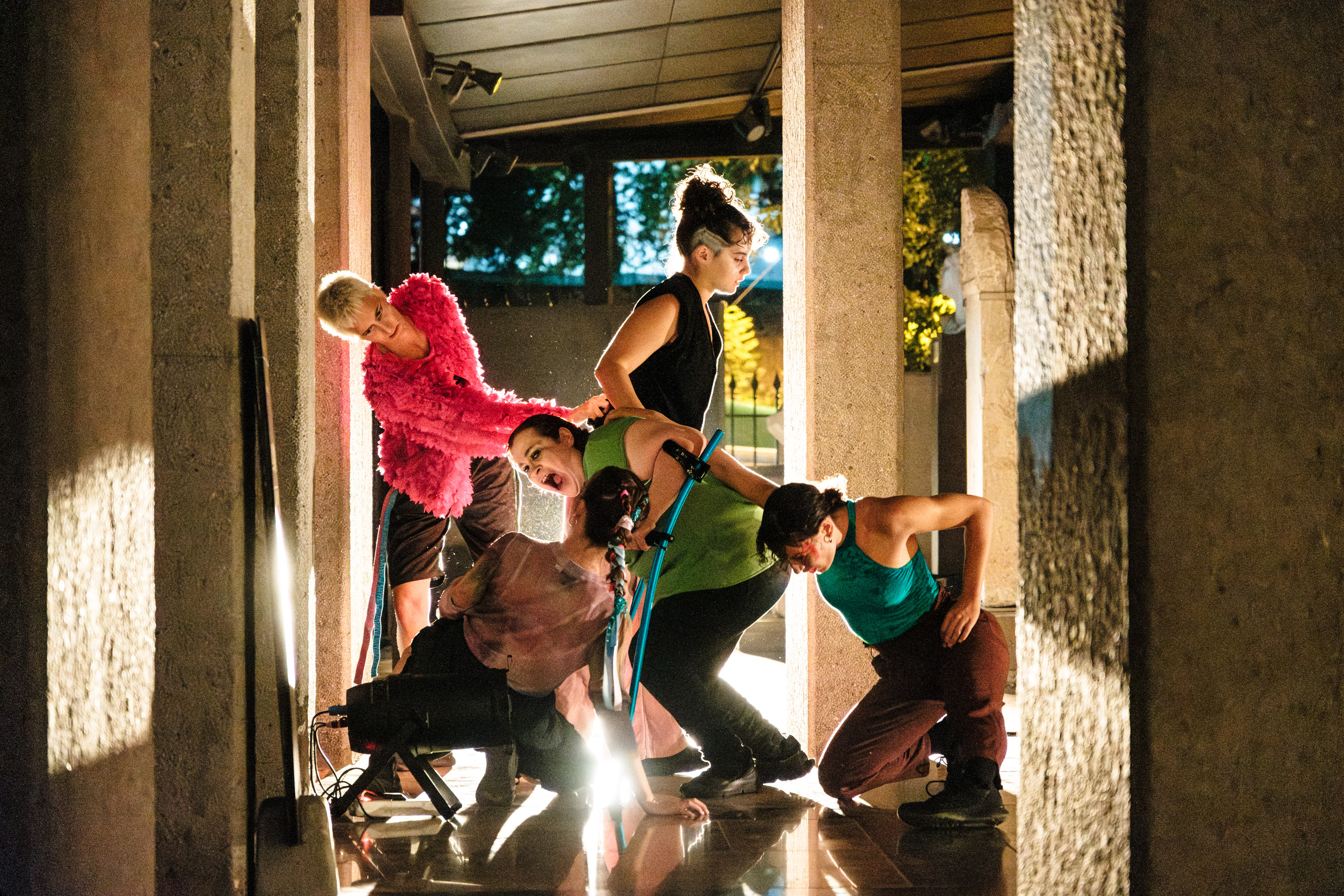 Five women support each other on different levels 