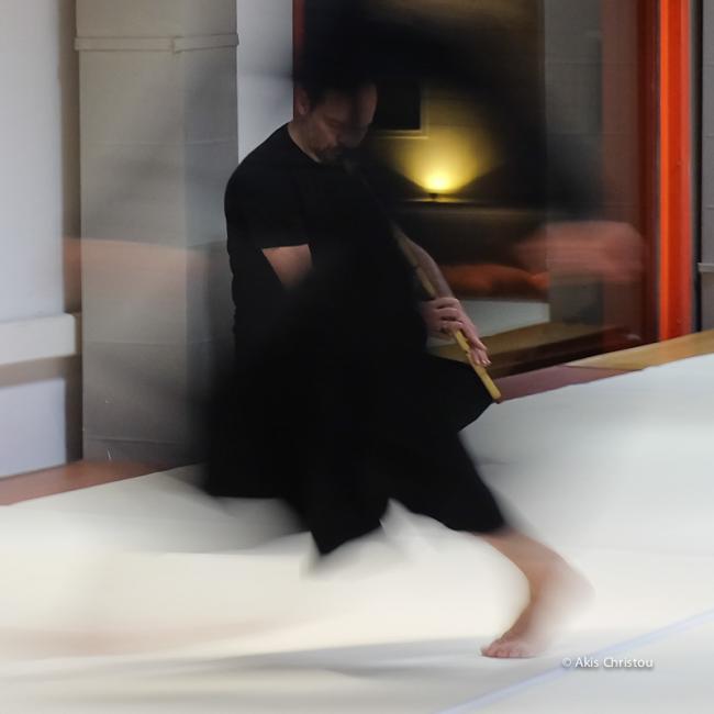 A vague photo of a performer and a musician