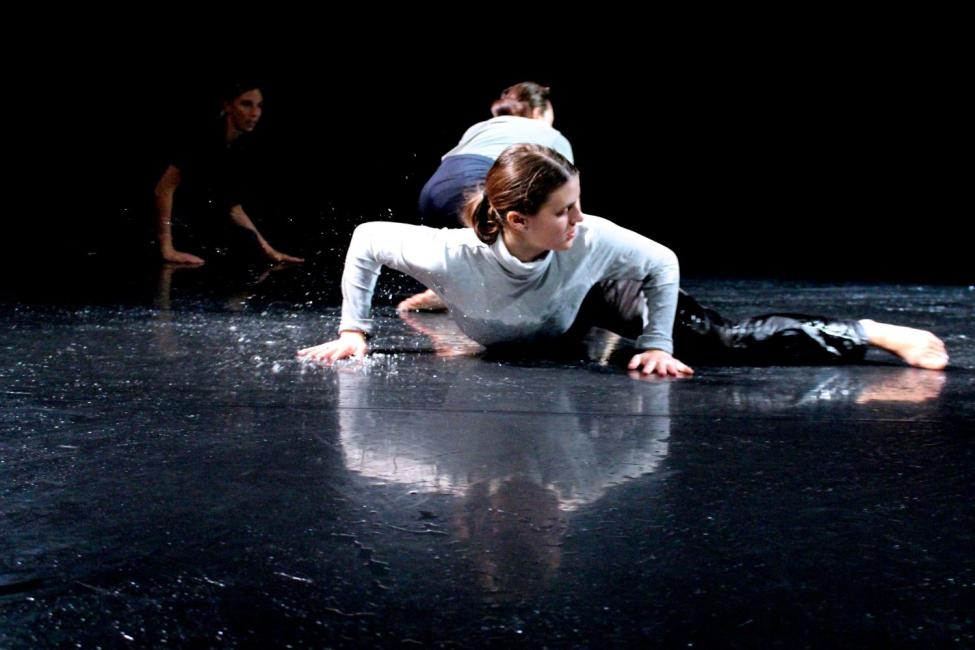 A woman sliding on low level very close to the wet floor